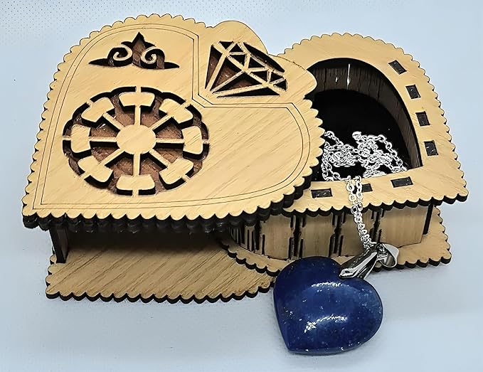 A lapis lazuli heart-shaped pendant necklace with a silver chain, presented in a laser-cut wooden box.