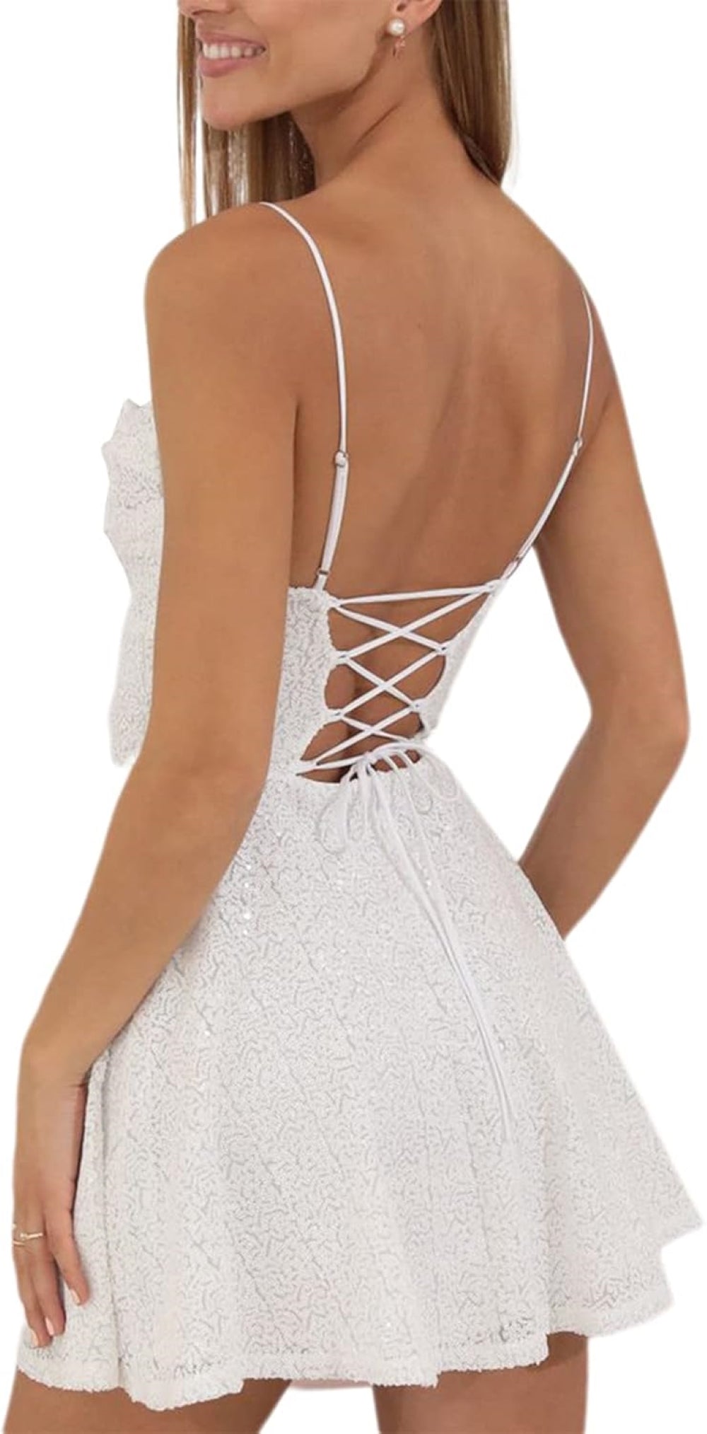 White sequin mini dress with a sweetheart neckline, thin spaghetti straps, fitted bodice, and flared skirt. Features a crisscross lace-up back detail. Shown against a plain background.