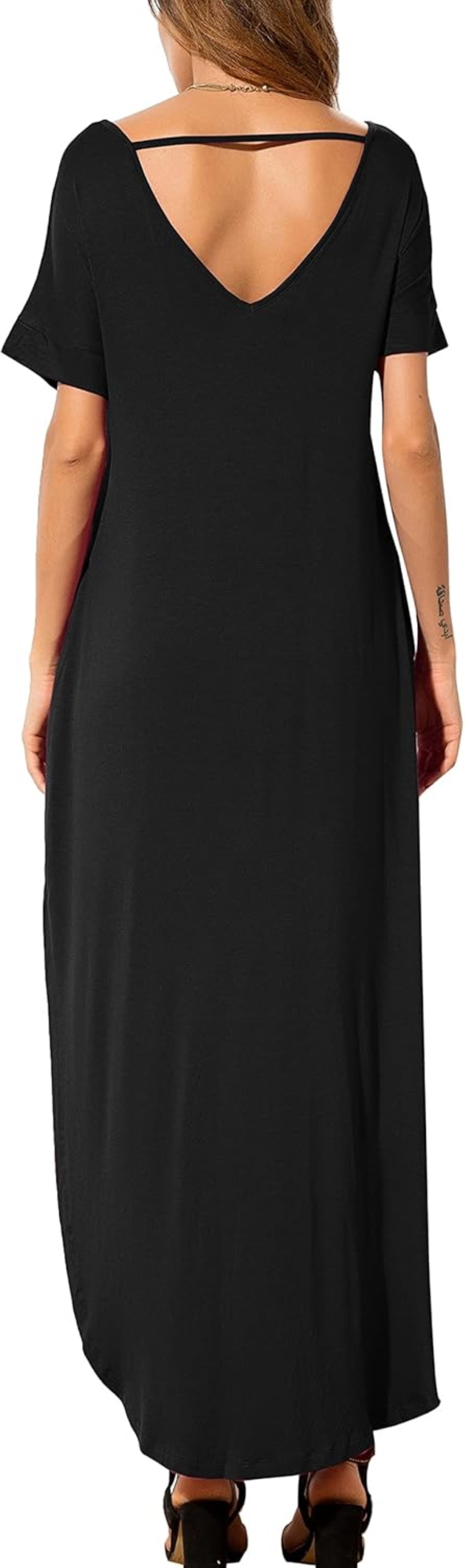 Woman showcasing a black Maxi dress with a deep V-back and short sleeves.