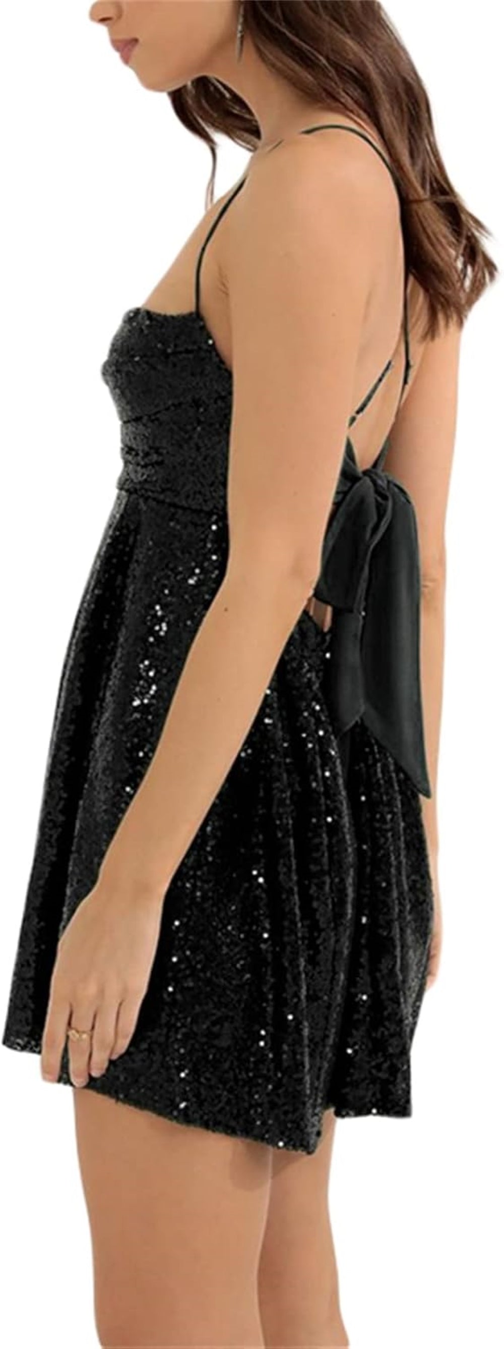 Black sequin mini dress with a sweetheart neckline, thin spaghetti straps, fitted bodice, and flared skirt. Features a bow detail at the back. Paired with a ring on the finger. Shown against a plain background.