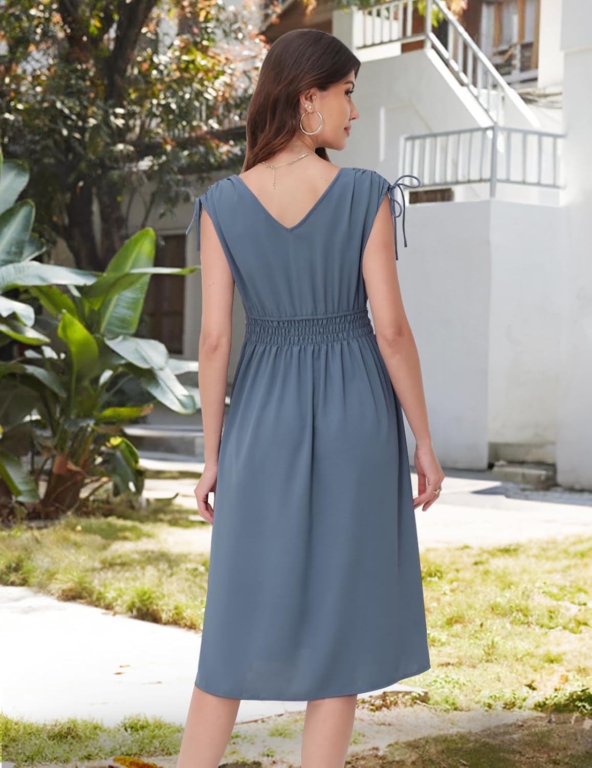 Denim-Blue dress with a V-neckline, cap sleeves, and a shirred waist.