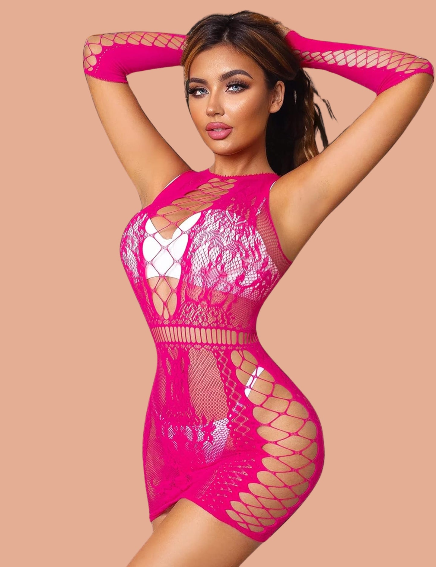 Model wearing a pink lace dress with intricate patterns and long sleeves, standing against a soft peach backdrop