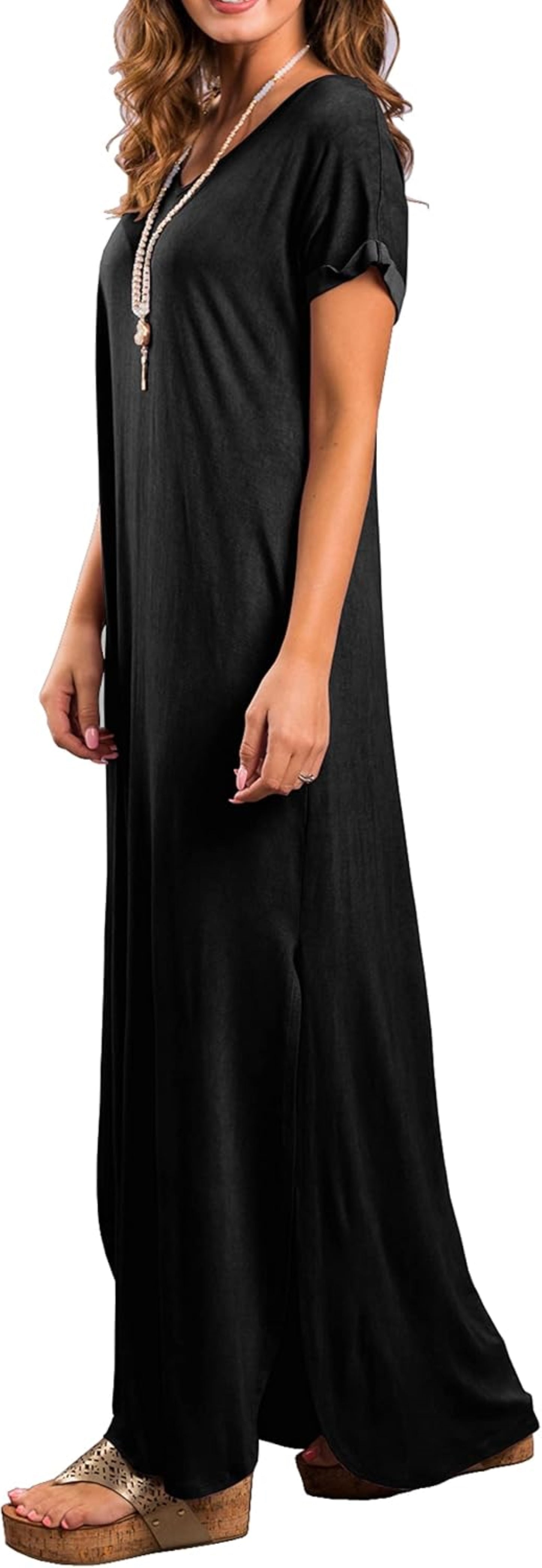 Model wearing a black, short-sleeved maxi dress with a V-neckline and side slit.
