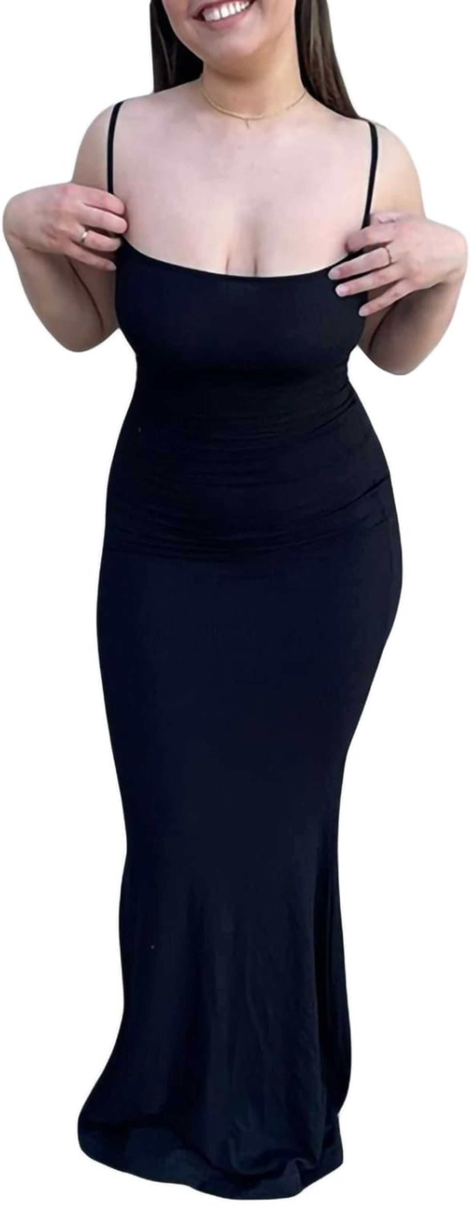 Model wearing Black sleeveless maxi dress with square neckline and stretchy fabric.