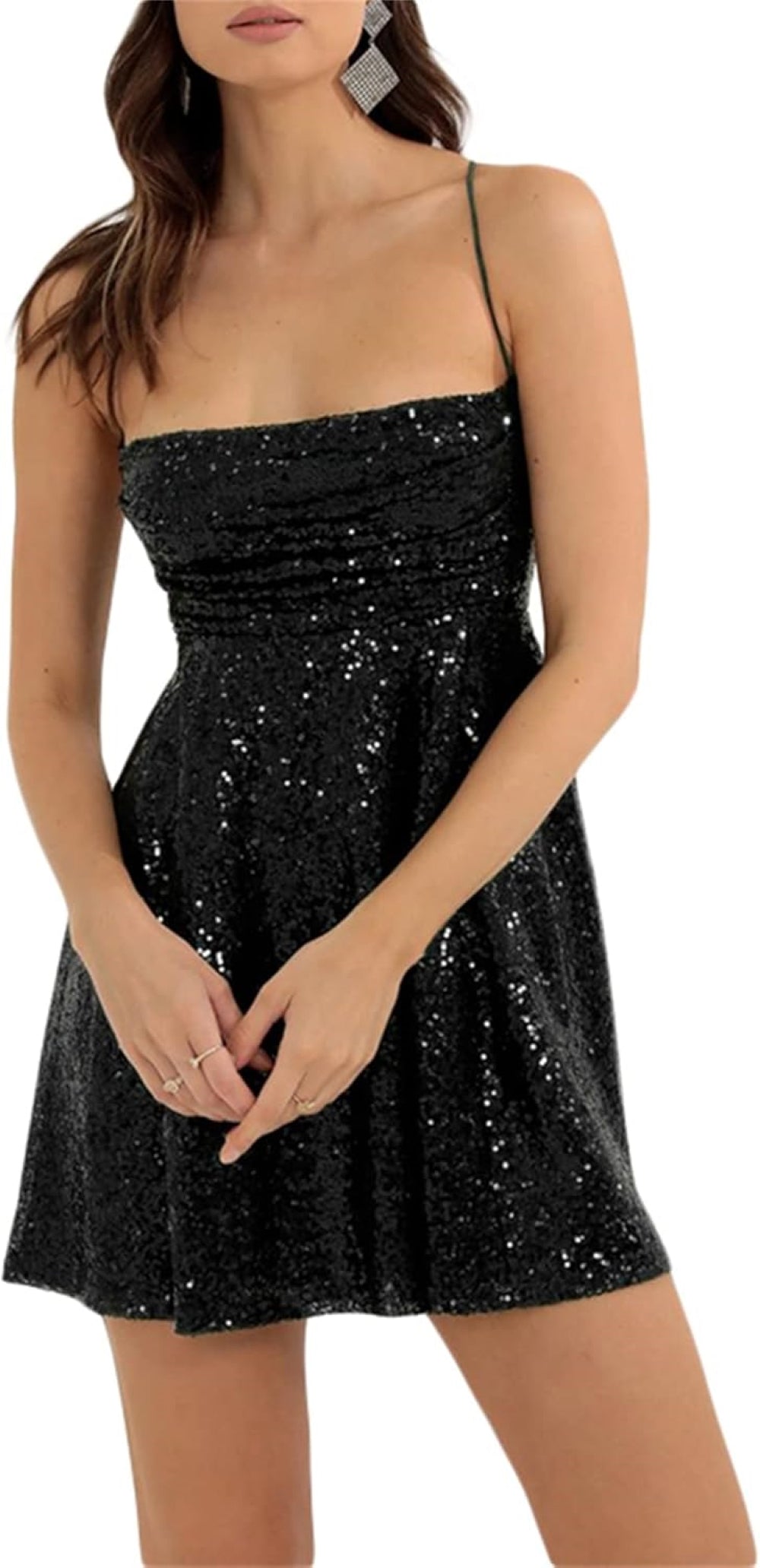 Black sequin mini dress with a sweetheart neckline, thin spaghetti straps, fitted bodice, and flared skirt. Paired with statement earrings. Shown against a plain background.