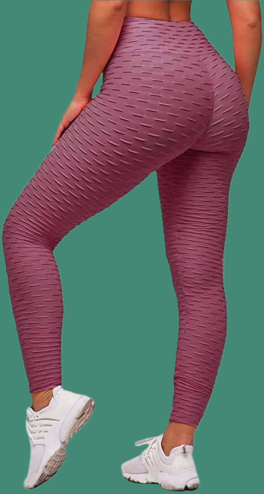 Bean Paste textured leggings paired with white sneakers. Full-length design with a high-waisted fit. Teal background.