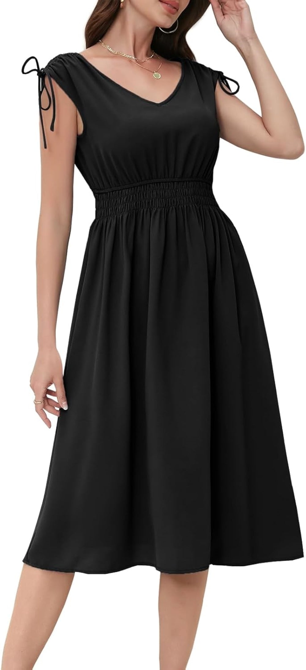 Black V-neck midi dress with elastic waistband, short sleeves with drawstring ties, and a flowy skirt. Paired with gold hoop earrings and layered necklaces