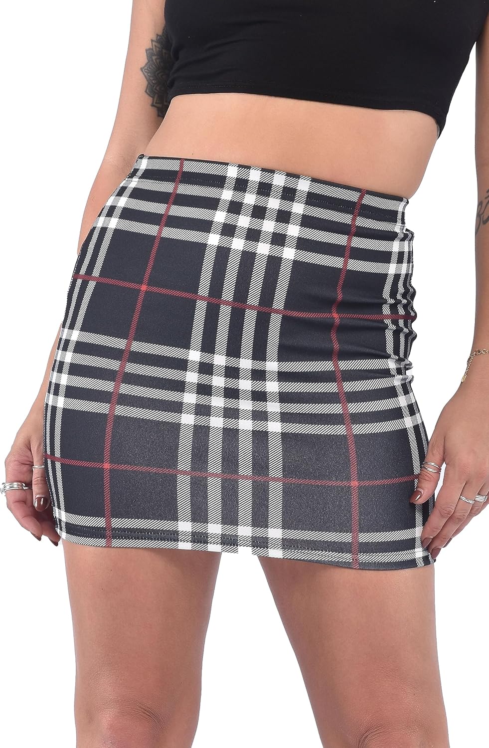 Black-Check plaid mini skirt with elastic waistband and checkered pattern. Classic, form-fitting design with smooth fabric for casual wear.