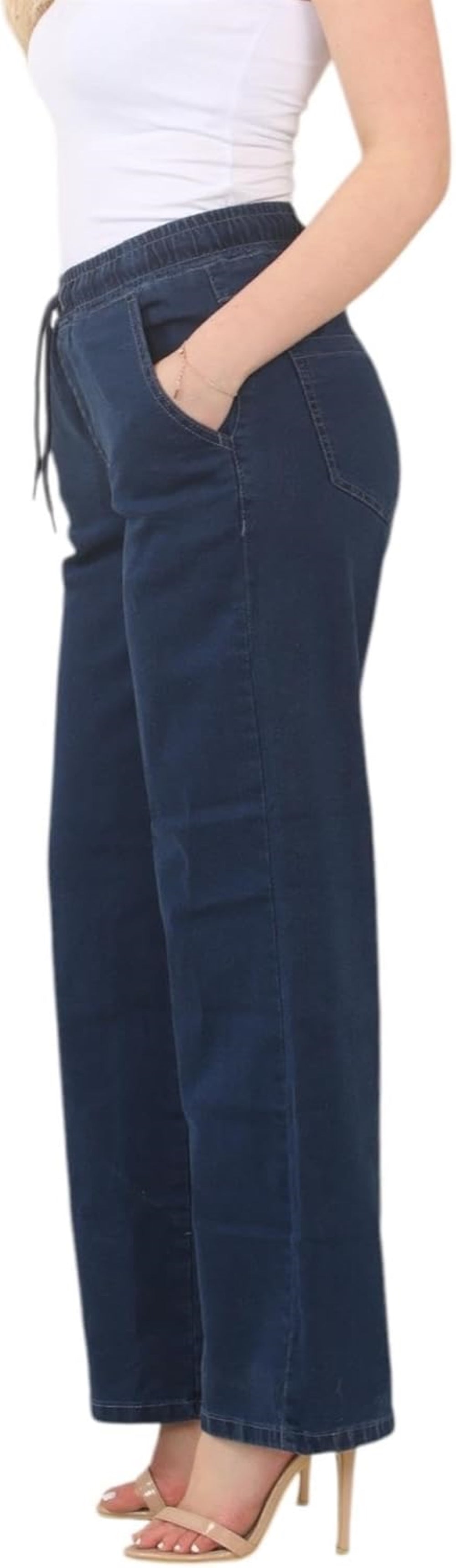 blue wide-leg pants with elastic waistband and pockets, paired with a white tank top and beige high-heeled sandals