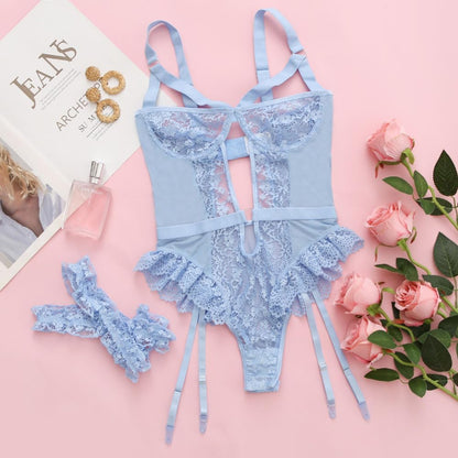 Blue lace lingerie bodysuit with mesh panels, lace trim, crossback straps, and keyhole cutout at waist. Elegant design with floral lace details and adjustable straps for a tailored fit.