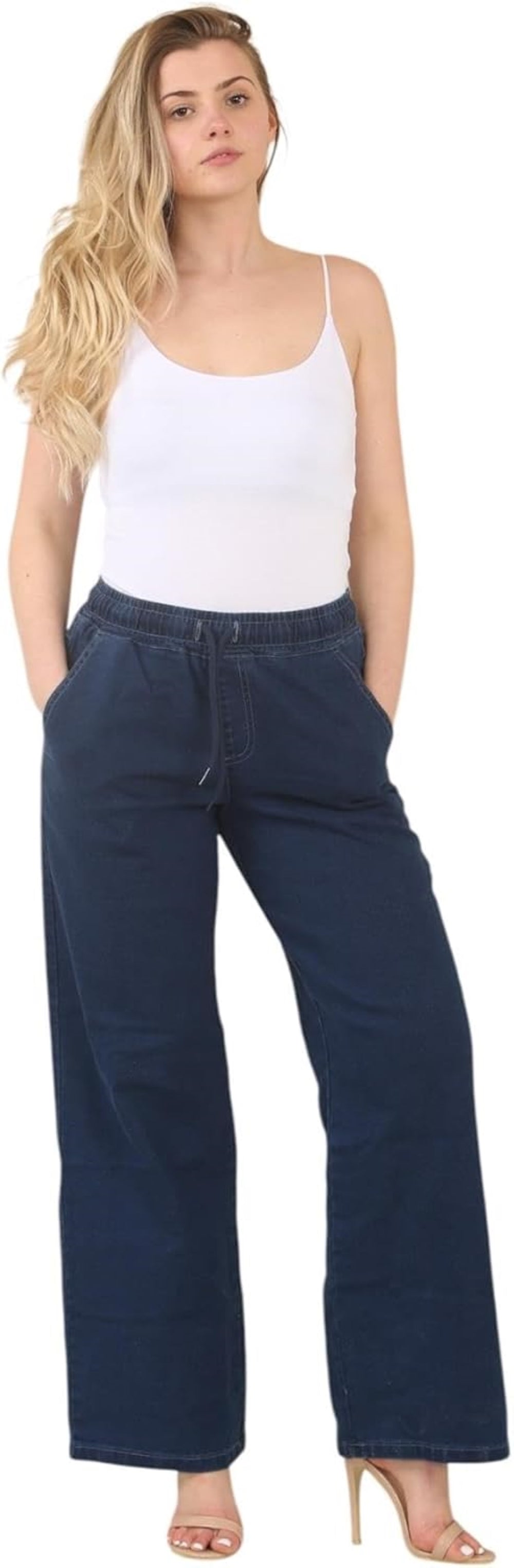 White tank top with thin straps and V-neckline, paired with navy blue wide-leg pants with elastic waistband and pockets.