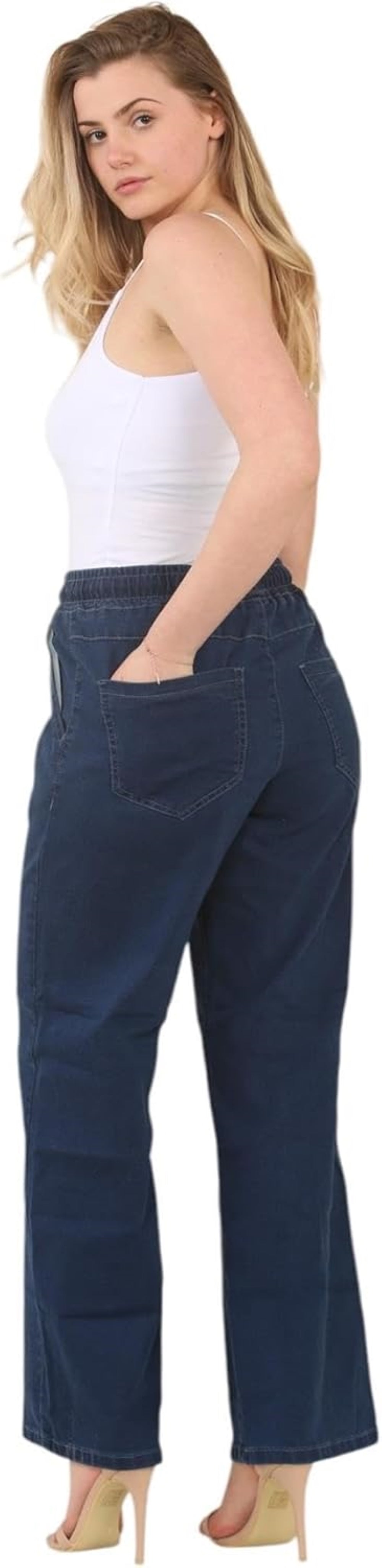 White tank top with thin straps and V-neckline, paired with navy blue wide-leg pants with elastic waistband and pockets.
