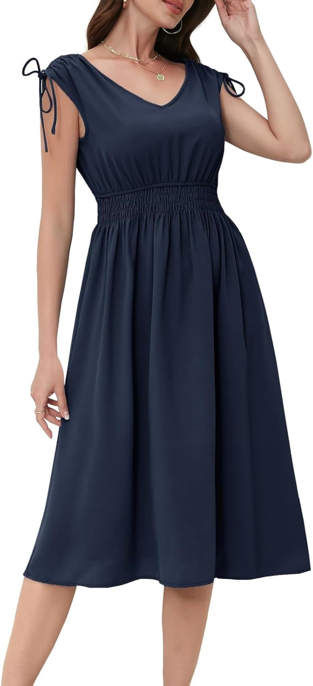 Navy V-neck midi dress with elastic waistband, short sleeves with drawstring ties, and a flowy skirt. Paired with gold hoop earrings and layered necklaces