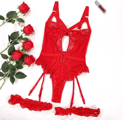 Red lace lingerie bodysuit with floral lace panels, adjustable shoulder straps, ruffled hem, matching garter belt, and lace trim. Feminine design with a keyhole cutout and delicate detailing.