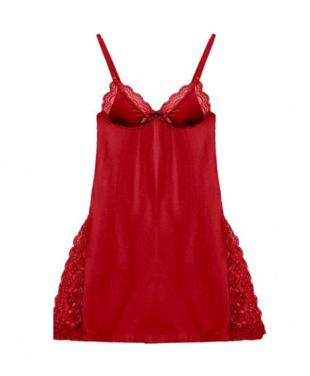  Red  chemise with lace trim and thin shoulder straps. Features a bow at the bust and a smooth, flowing skirt with lace hem.